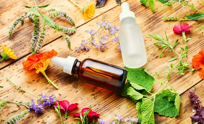 Why should you use live flowers or natural essential oils to make your home smell nice instead of air freshener sprays or scented candles?