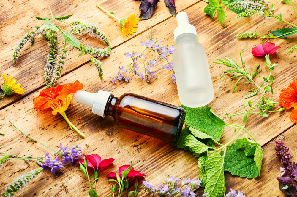 Why should you use live flowers or natural essential oils to make your home smell nice instead of air freshener sprays or scented candles?