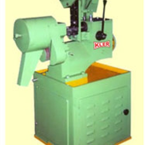 Nut header machine